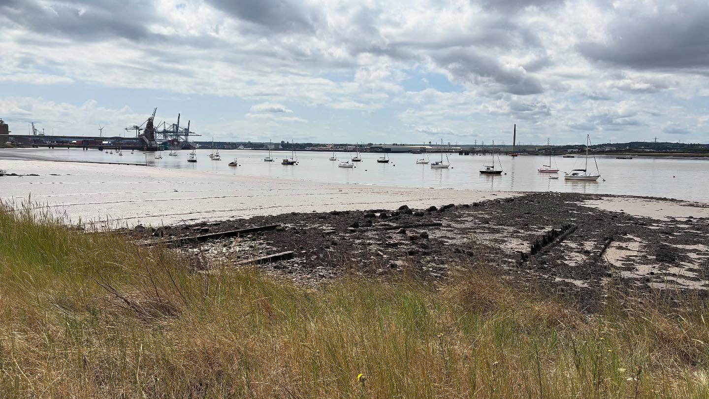 Peaceful moments by the estuary 🌾⛵
Low tide reveals the rugged beauty of the shoreline, with sailboats gently resting on calm waters and industrial cranes standing tall in the distance. A perfect blend of nature and industry under a dramatic summer sky. 🌥️✨

#EstuaryVibes #CoastalWalks #LowTide #SailboatViews #NatureAndIndustry #TranquilWaters #SummerByTheWater #BritishCoastline #HiddenBeauty #CloudySkies #MaritimeMoments #WatersideWander